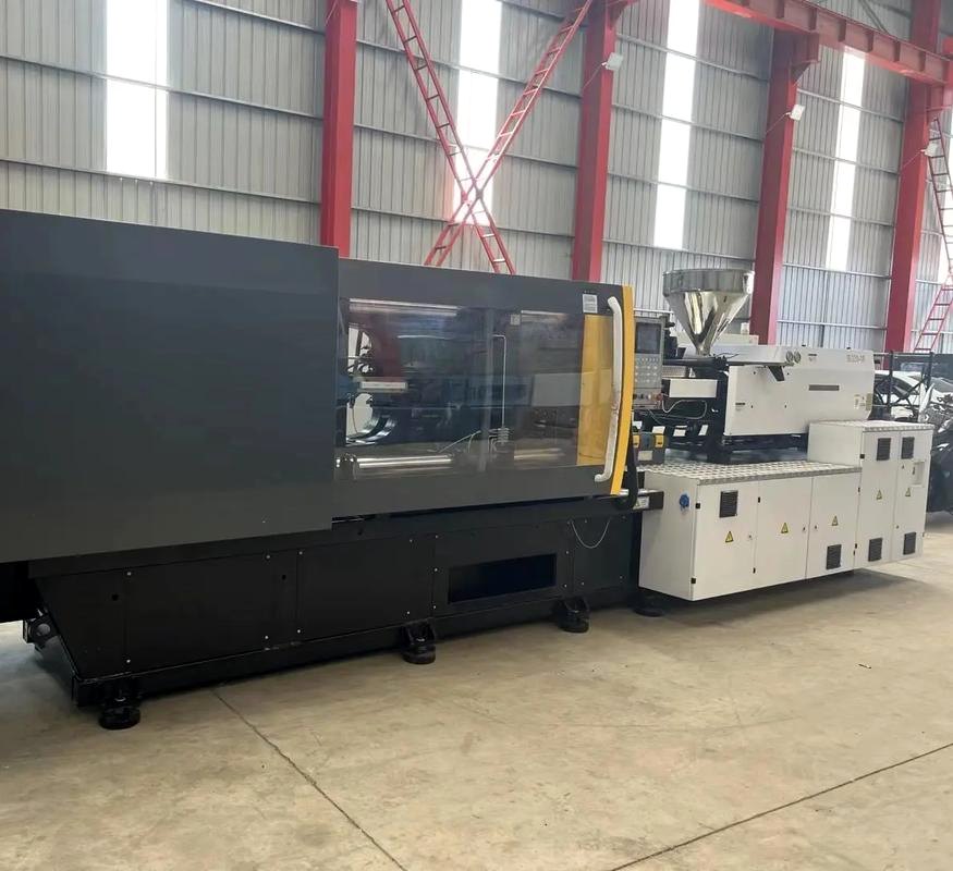 Injection molding machine installed on a factory floor